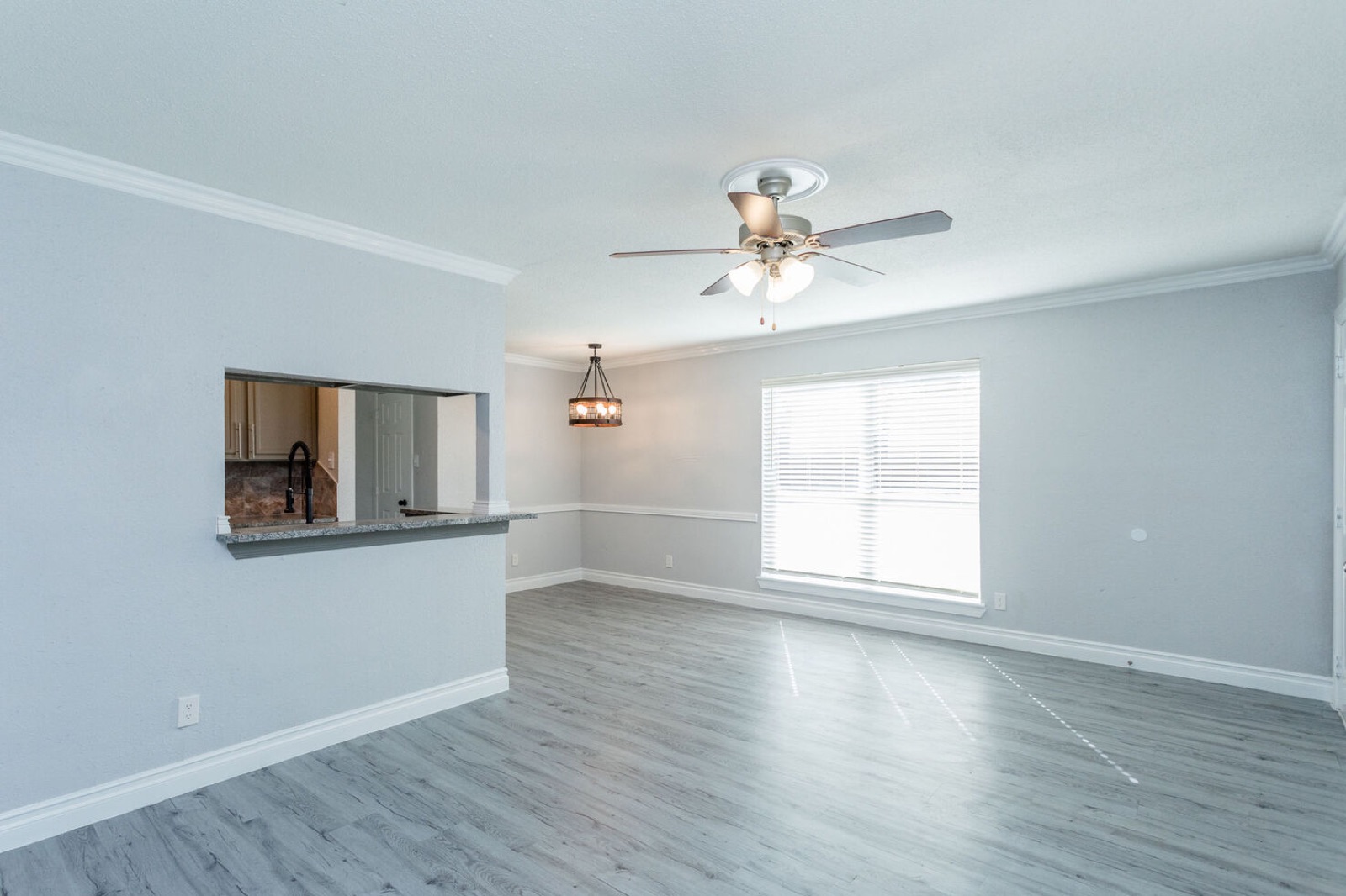 Renovated multifamily unit interior with new flooring and finishes